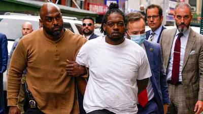 Man accused of unprovoked shooting on NYC subway surrenders