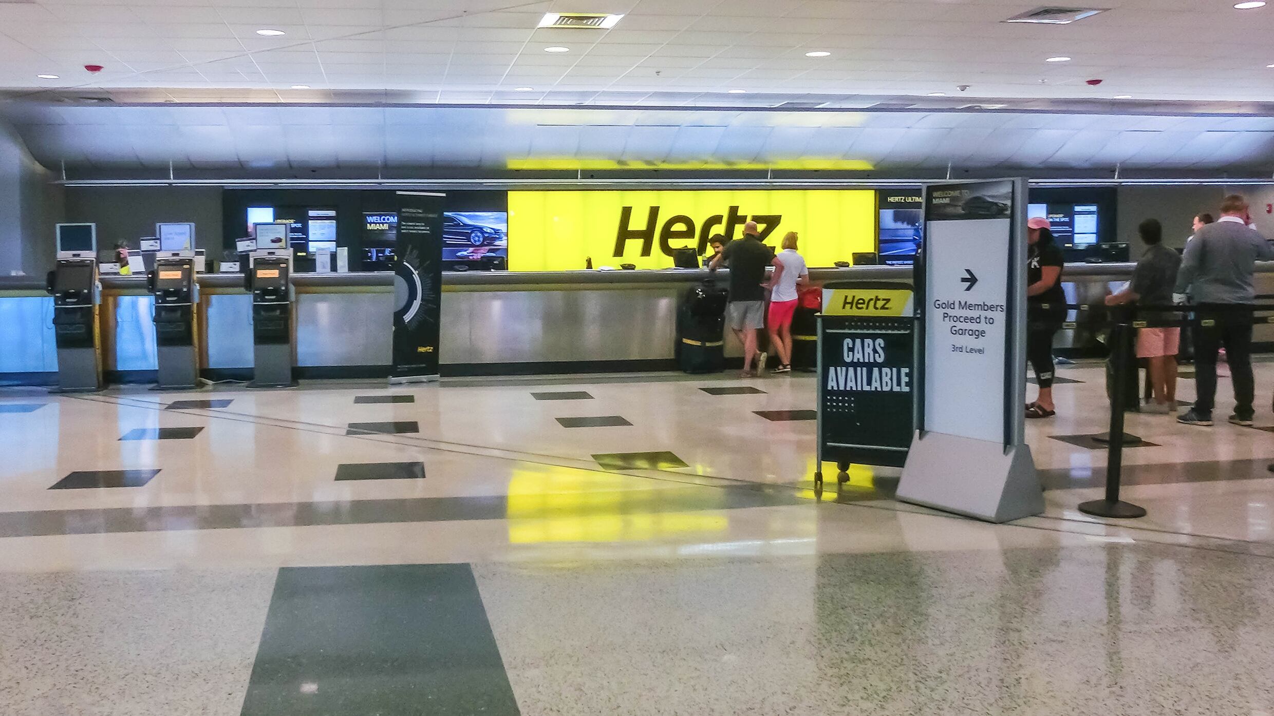 People near Hertz rental car office at Miami airport at Miami, Florida