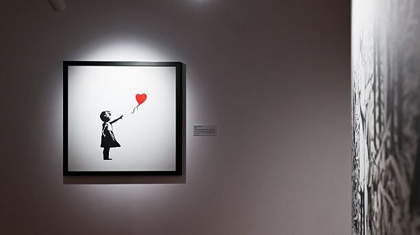 Art hanging on a wall in a gallery